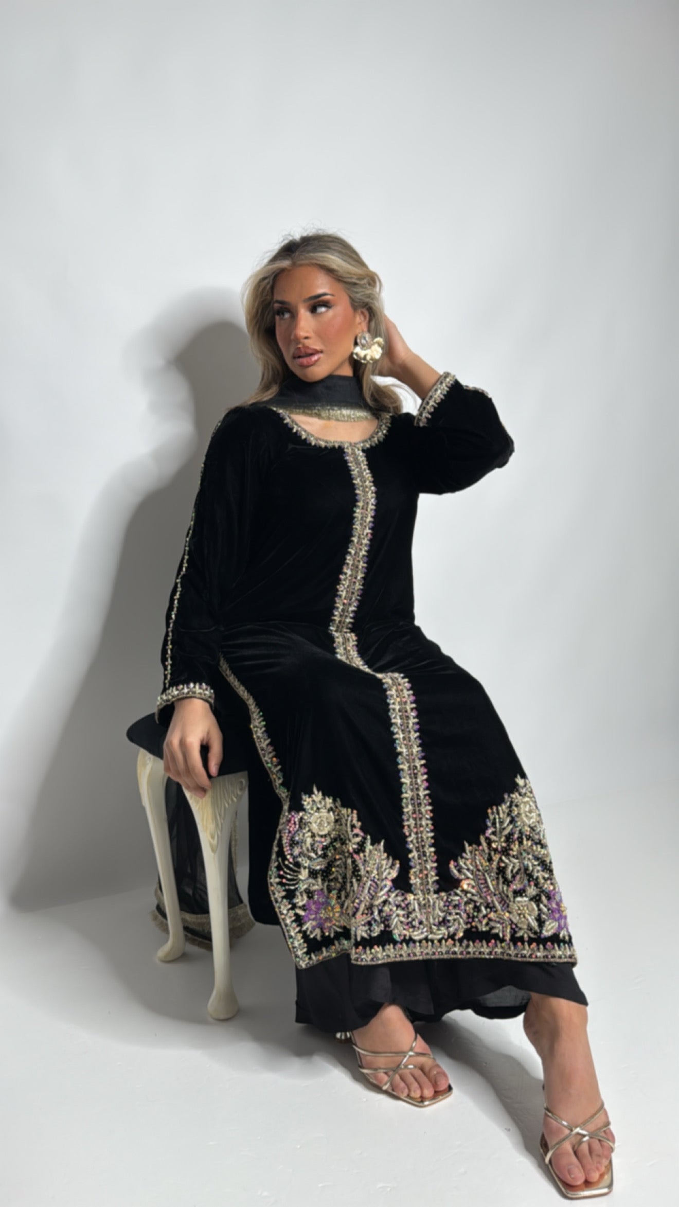 Hand embroidery detail on black velvet kameez