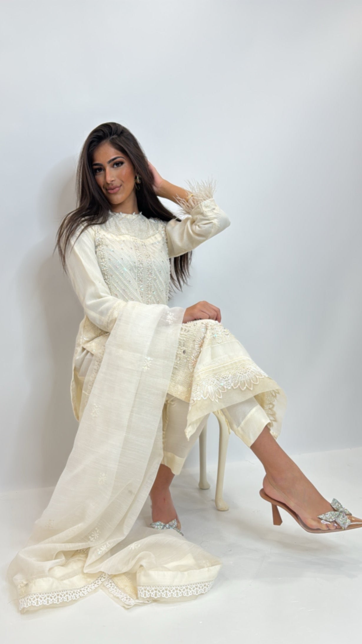 Front view of Elara Ivory khaki net embroidered kameez set with feather cuff detailing.