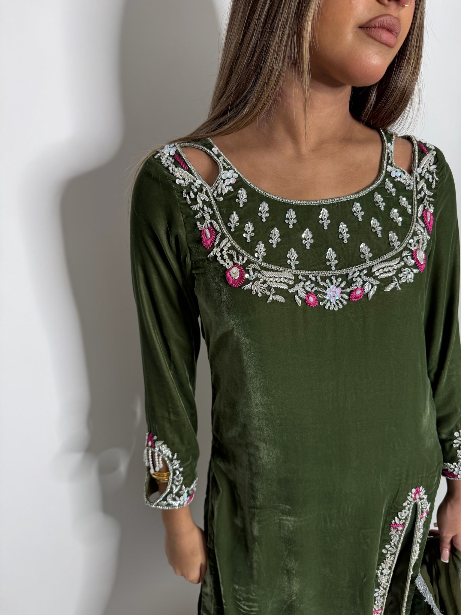 Pearl and embroidery detail on velvet sleeve cuffs