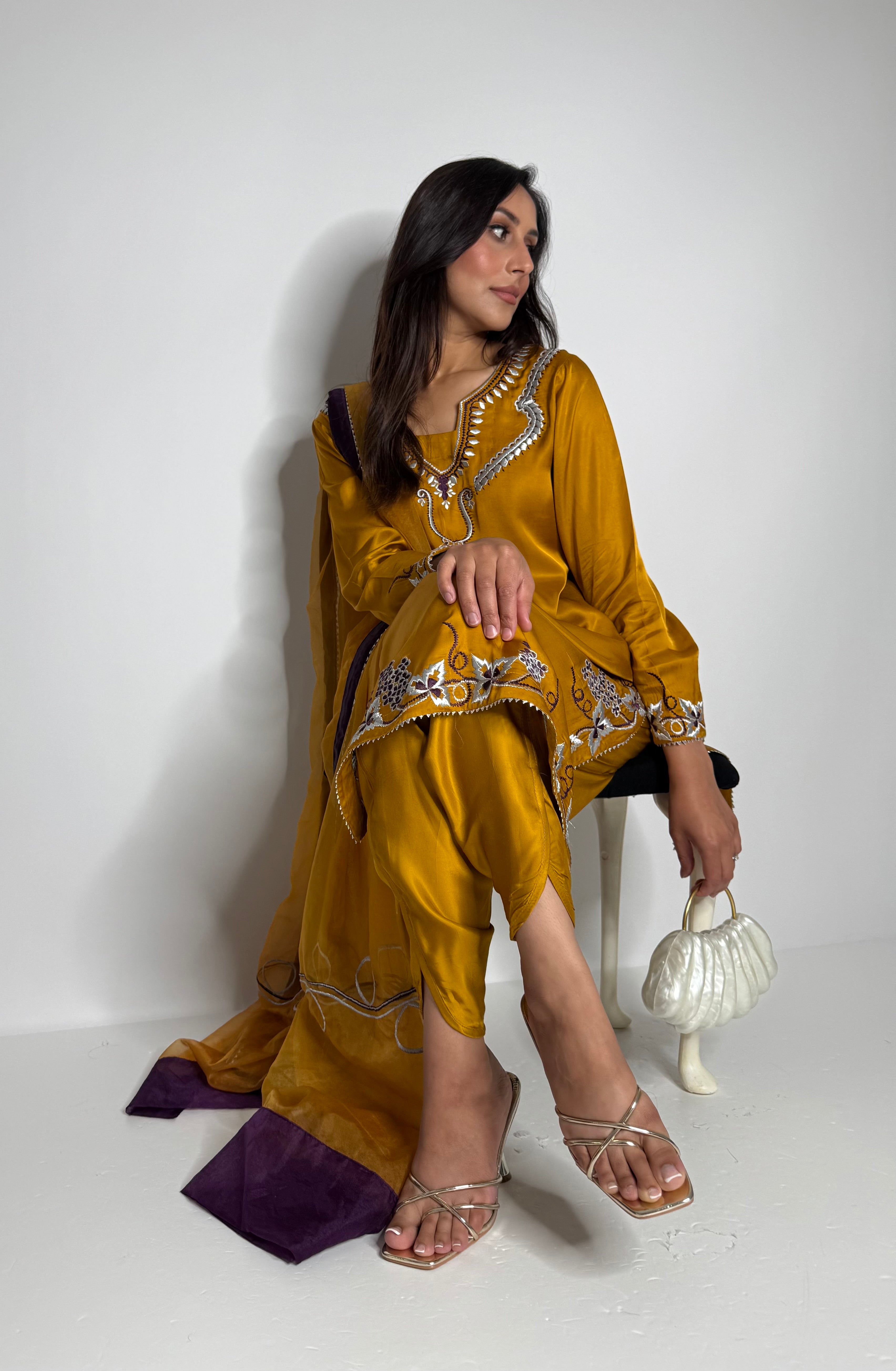Mustard organza dupatta styled with silk tulip suit
