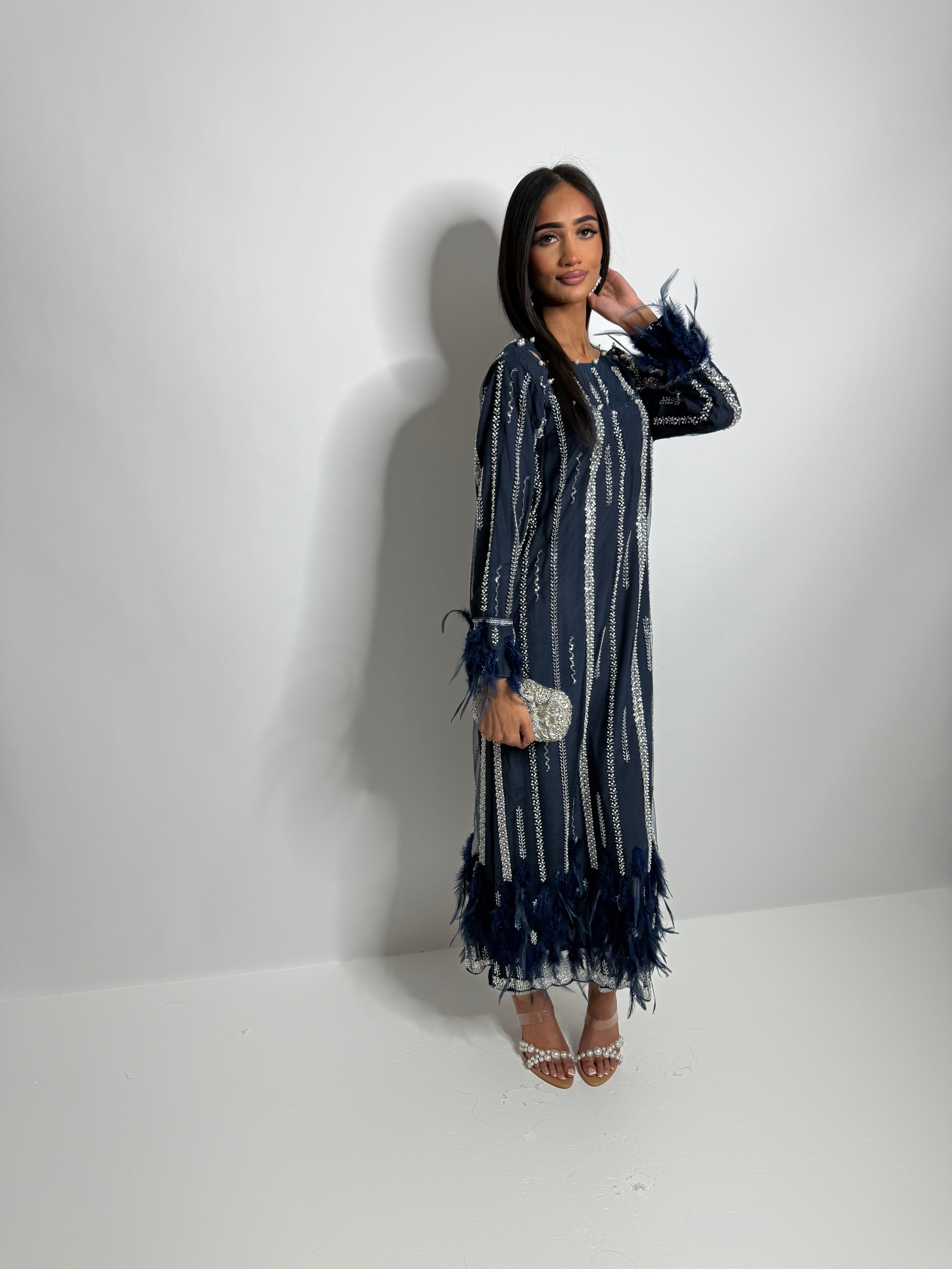 Vertical cutdana embroidery on navy kameez for elegant evening occasionwear.