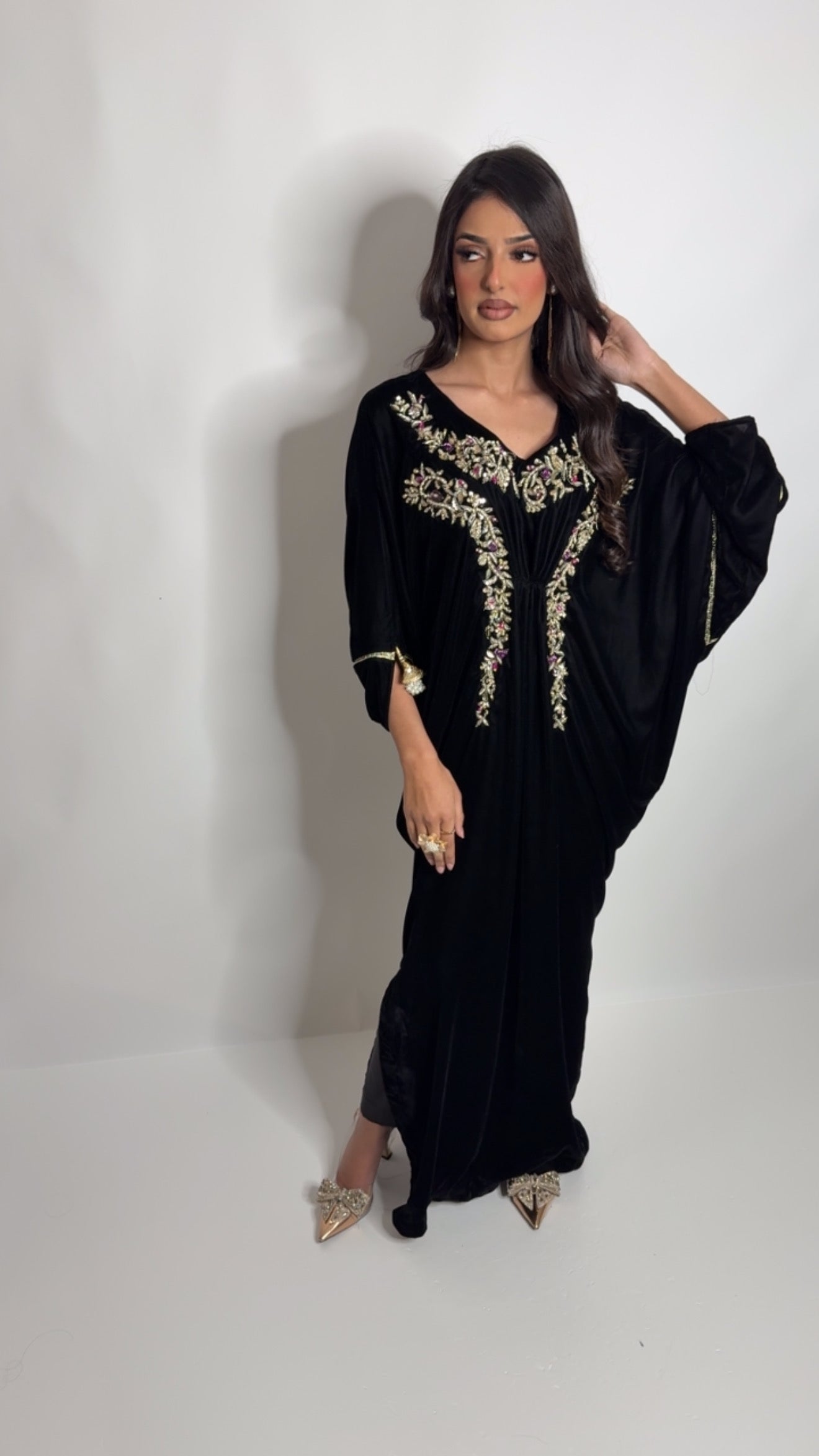 Vintage gold embroidery detail on black velvet kaftan