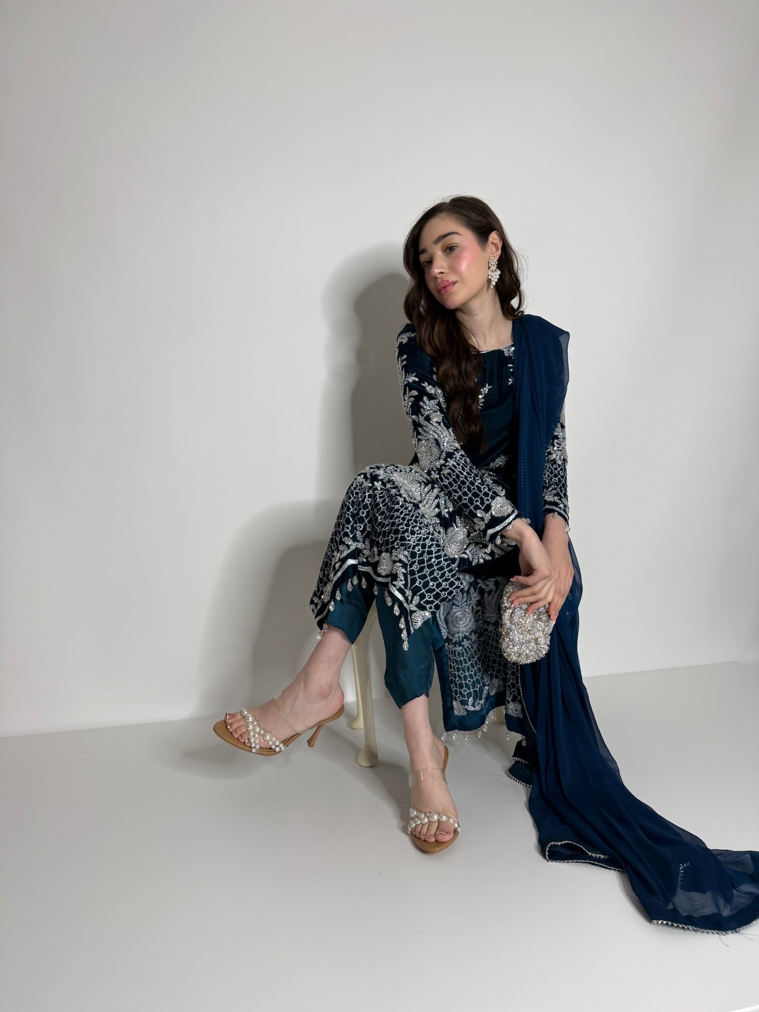 Silk trousers paired with teal velvet kameez
