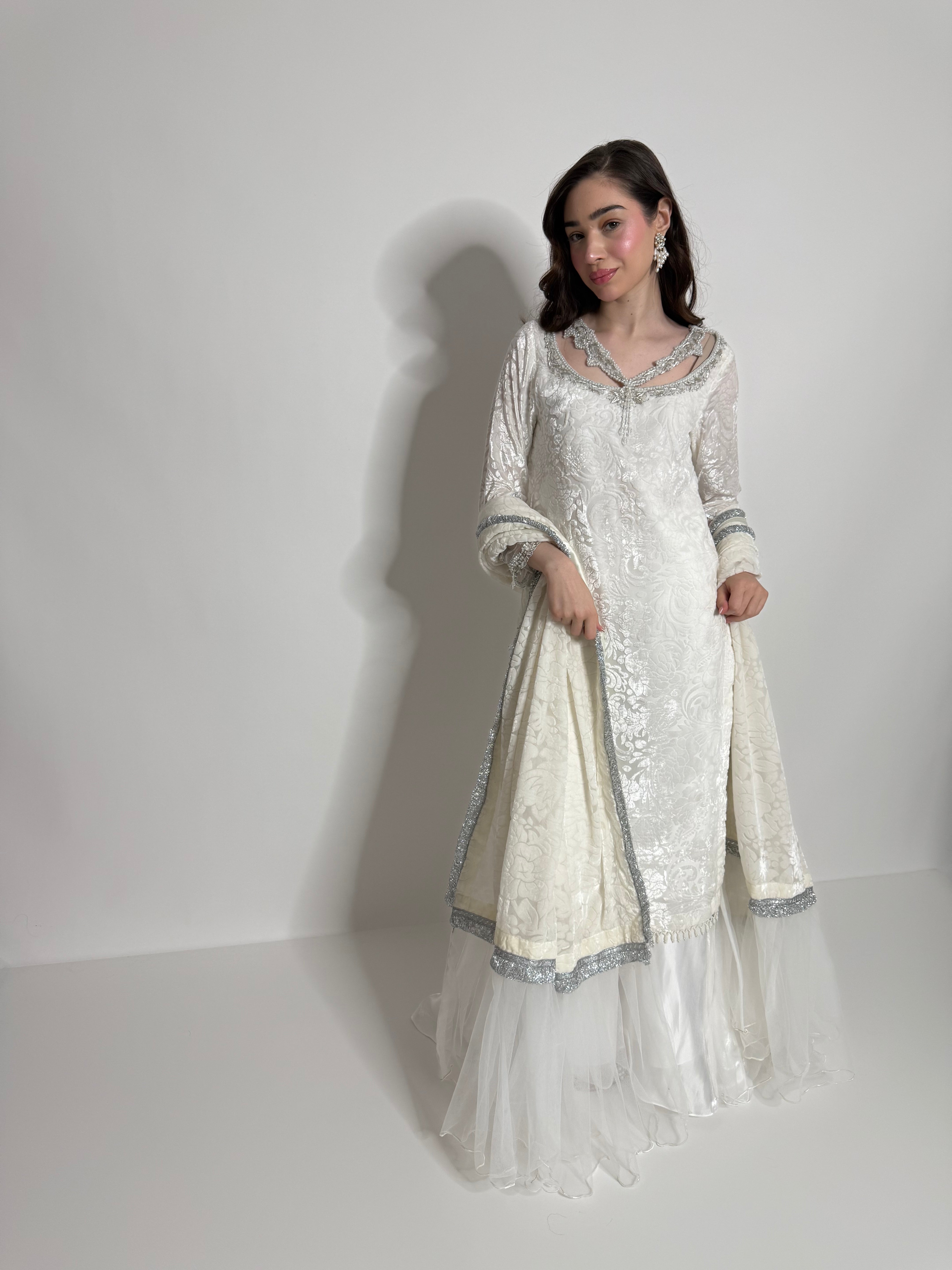 Hand embellished neckline on ivory palachi kameez