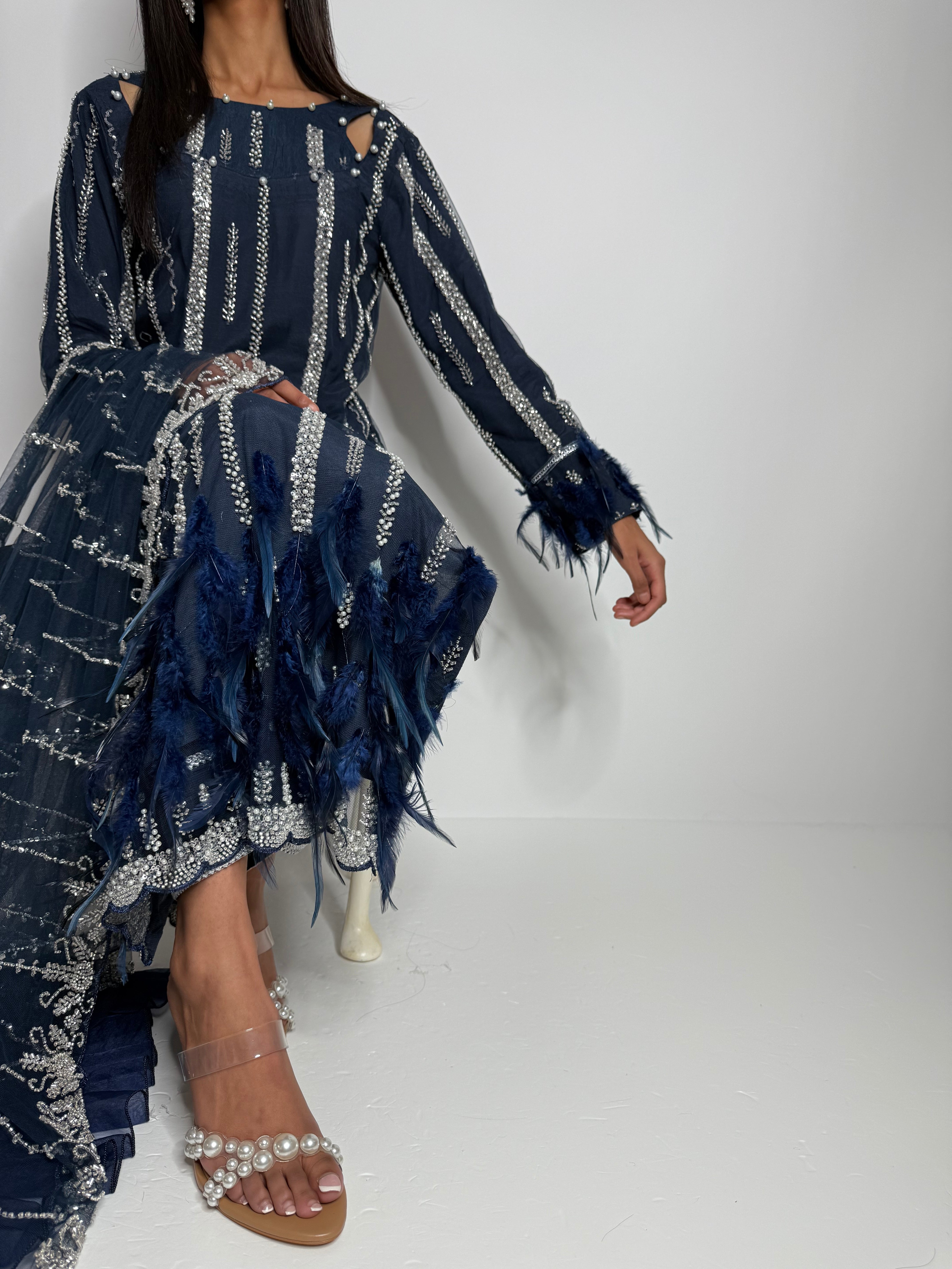 Luxury navy Eid outfit UK featuring feather cutdana kameez and raw silk trousers.