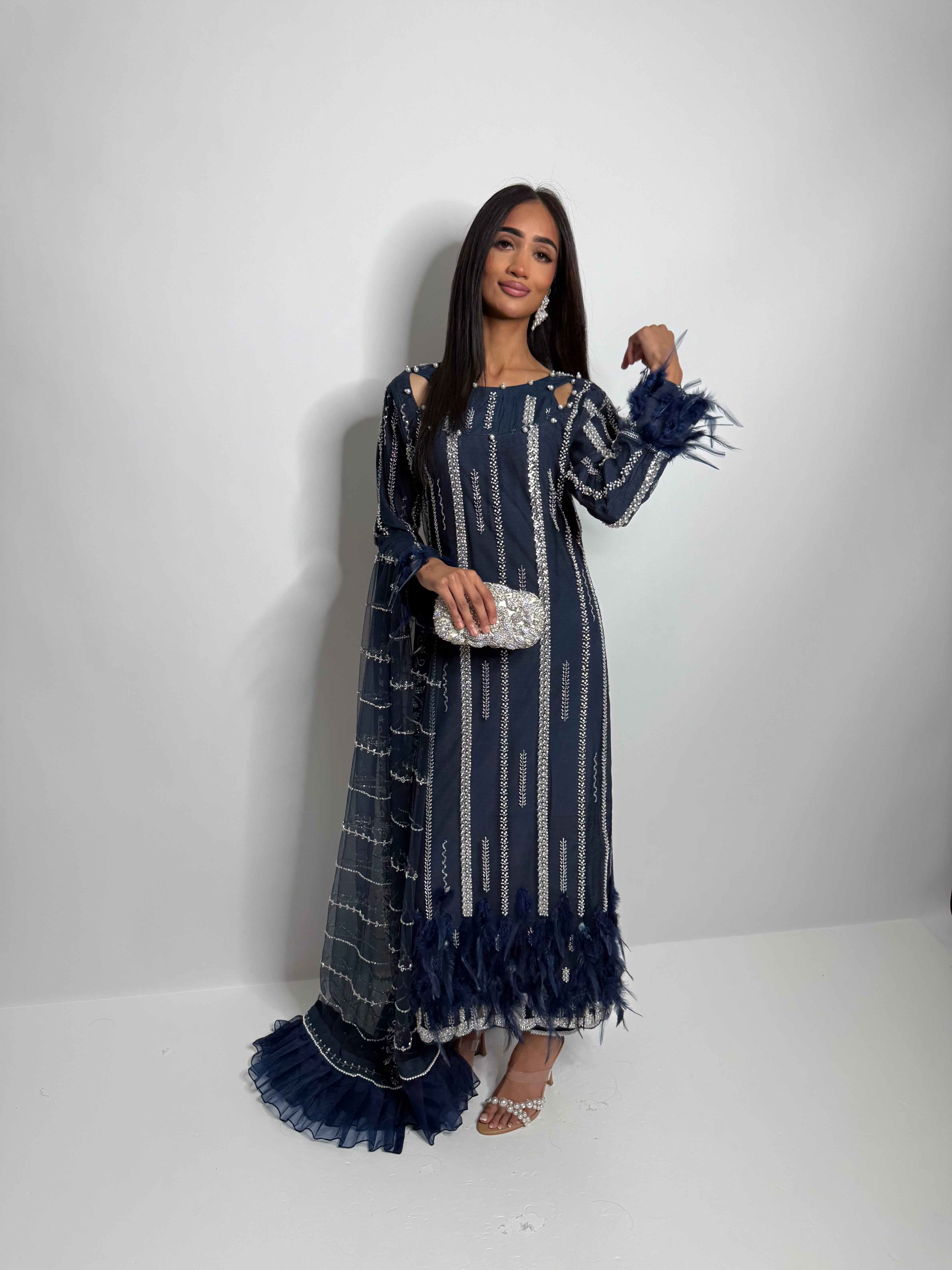 Full length navy Pakistani suit UK with vertical cutdana embroidery and feather sleeve detail.