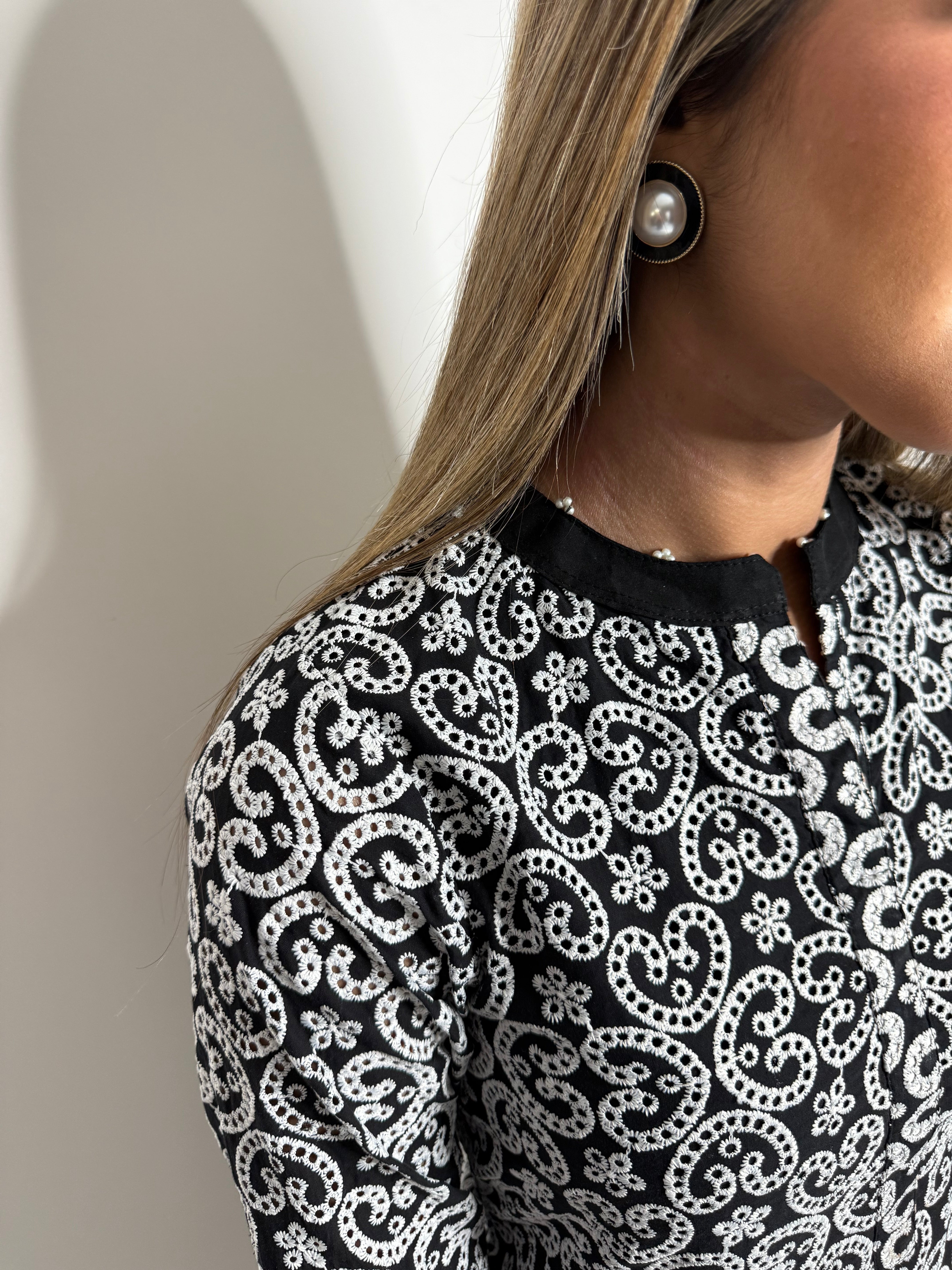 Black and white kameez sleeve finishing detail
