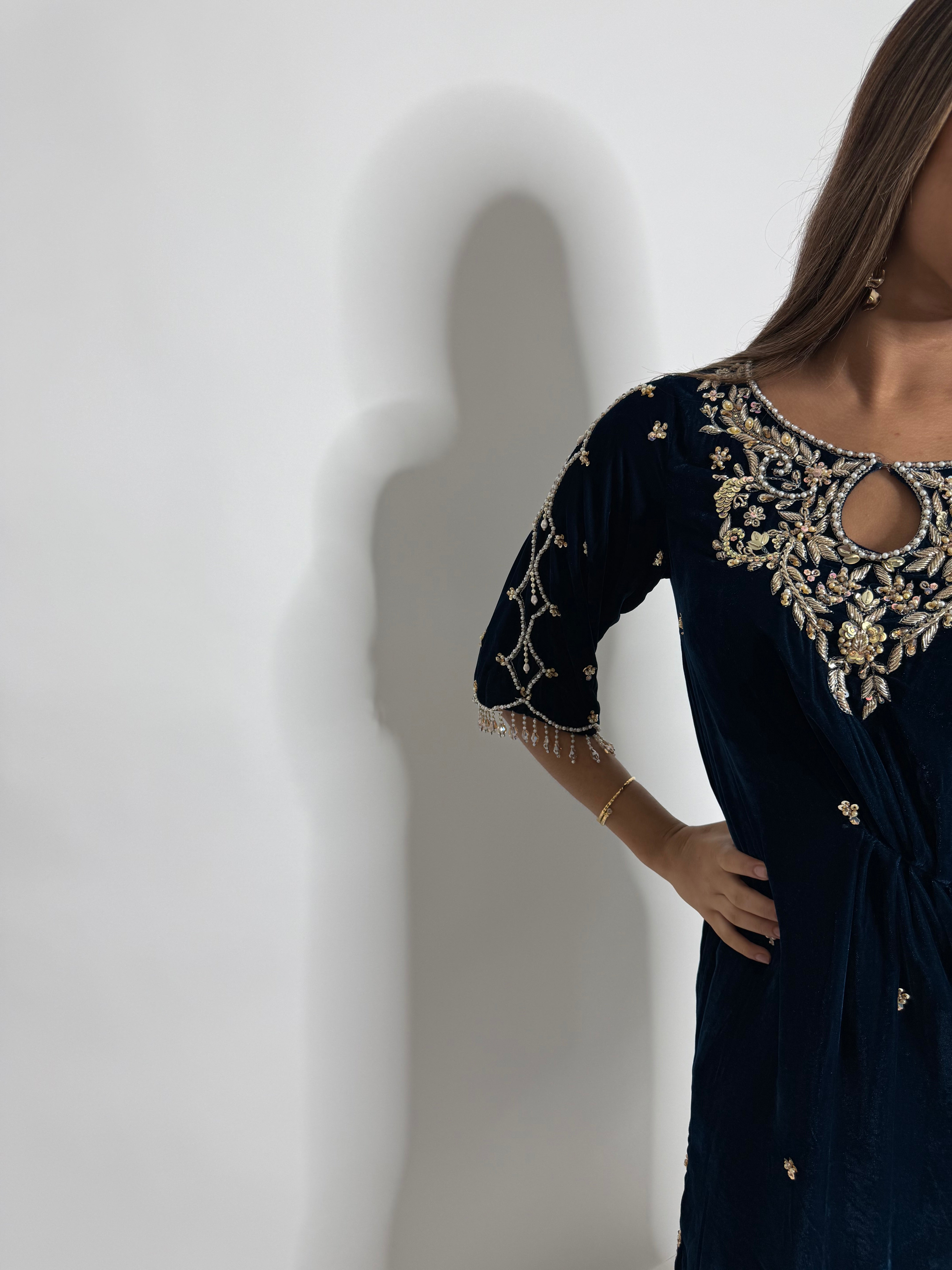 Embellished sleeve detail on midnight velvet suit